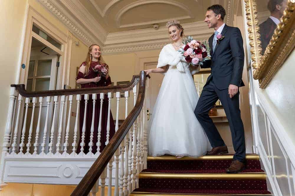 Bride and groom on the staircase at The Bedford Hotel